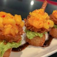 Crispy Shrimp Rice (4) · Coconut crispy shrimp served with crispy sesame rice, guacamole, and Asian sauce.