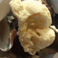Profiteroles · with vanilla ice cream and chocolate sauce