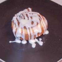 Cinnamon Rolls · Two Cinnamon Rolls Covered with Cream Cheese  Frosting