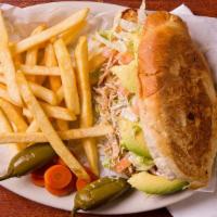 Torta De Pierna · served with lettuce, tomato, avocado, mayonnaise, sour cream and fries