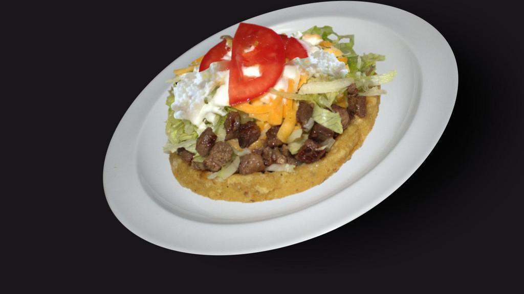 Sopes · Three mini-sopes with refried beans, sour cream, lettuce, tomato, avocado, and queso fresco. Your choice of one of the following meats: carnitas, bistec, pastor, or chicken.