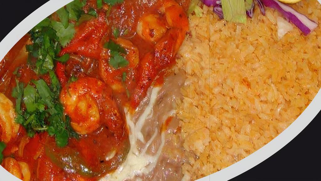 Camarones A La Diabla · Fried shrimp bathed in red spicy sauce with onions, served with rice and beans and tortillas of your choice. Corn or flour (3).