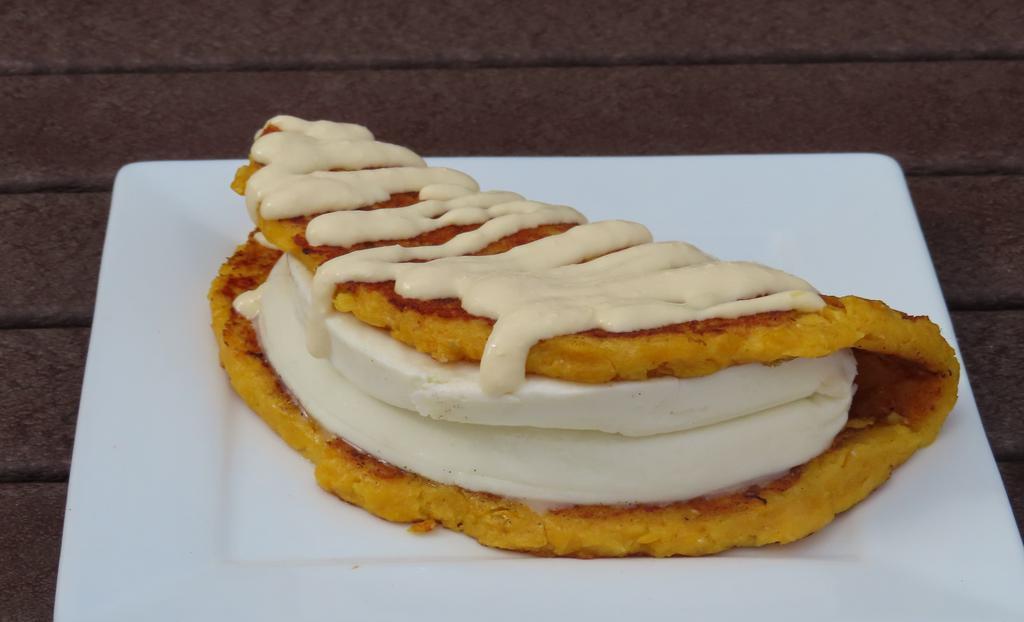 Cachapa (Cheese And Roasted Pork) · Sweet corn cake with venezuelan cheese and roasted pork.