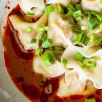 Chili Wontons 红油抄手 · Pork filled wontons served with chili oil and peanut sauce