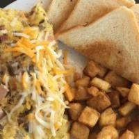 Freddy'S Omelette · Two egg omelette with diced ham, bacon, sausage, mushroom, bell peppers, onions & Cheddar Ja...