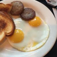2 Eggs Cooked To Order · Served with side of ham, bacon or sausage, toast and home fries.