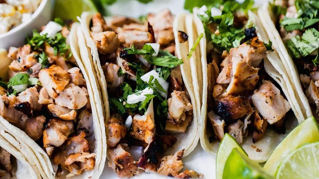 Chicken Taco · 4 chicken street tacos, with onion and cilantro. Choice of corn or flour tortillas.
