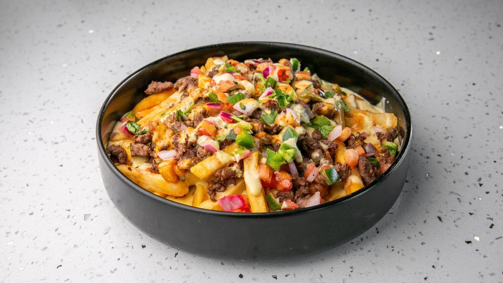 Catedral Loaded Fries · Fries smothered in three cheese blend, topped with pico and jalapeño crema. Add carne asada, birria beef, pastor or chicken for an additional charge.