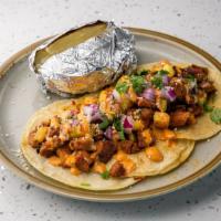 Al Pastor · Marinated and slow roasted pork in our adobo, grilled pineapple, onion, cilantro, topped wit...