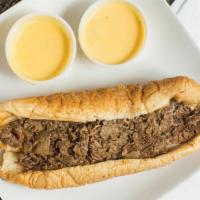Cheezy Cheesesteak · Our authentic philly cheesesteak sandwich, topped with American swiss cheese and our homemad...