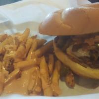 Rudy Burger · Our hand made 1/2 pound patty with grilled onions, jalapenos, and mushrooms. With a splash o...