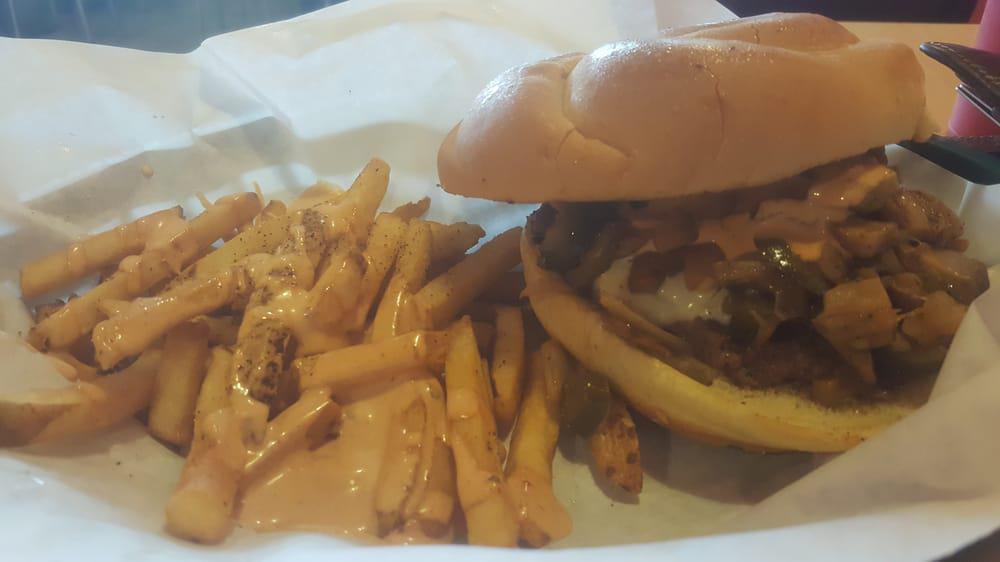 Rudy Burger · Our hand made 1/2 pound patty with grilled onions, jalapenos, and mushrooms. With a splash of our homemade mayotle sauce, topped off with American swiss cheese.