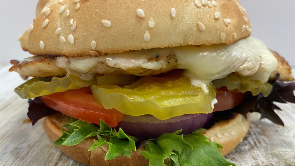 Grilled Chicken Sandwich · Marinated chicken, mayo, lettuce, tomato, pickles, and onions.