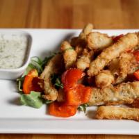 Greek Zucchini · Crispy golden brown zucchini strips coated in a satisfying breading, served with freshly mad...