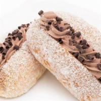 Chocolate Buttercream · A plump sweet bun, sliced open and filled with chocolate cream, sprinkled with coconut flake...