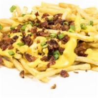 Bacon Cheese Fries · Classic julienne cut fries smothered in generous heaps of melted cheese, bacon, and spring o...