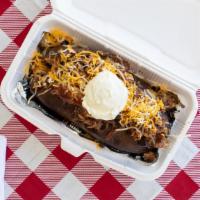 Loaded Baked Potato · A spud full of butter, chopped brisket or Meyer's sausage, sauce, grated cheese and sour cre...