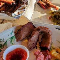 Family Pack · 2 pounds of brisket, 1 pound of Meyers sausage, 2 large sides (your choice), bread, pickles,...