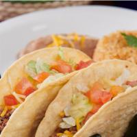 Traditional Street Tacos · Gluten Friendly. Four mini corn tortillas filled with diced steak fajita meat, topped with c...