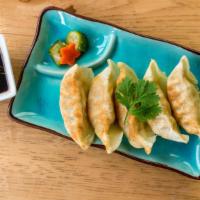 Gyoza Vegetable · Vegetable Pot Stickers served with a side of garlic ginger sauce.