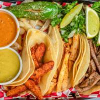 Tacos · Choice of meat: trompo, fajita, chicken barbacoa, pernil pork (Puerto Rican carnitas).