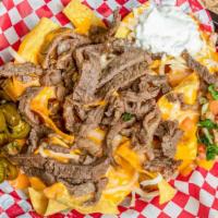 Nachos · Freshly fried tortilla chips, melted nacho cheese with 1 meat, shredded cheese, jalapeños, p...