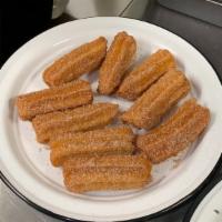 Classic Churro Bites (12 Pack) · With a choice of dipping sauce. Four sauces included.
