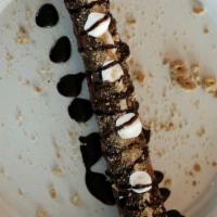 S' More Churro · Churro drizzled with marshmallow sauce, Nutella, Hershey's Chocolate topped with graham crac...