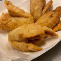 Crab Rangoon · Cream cheese crab filling served with sweet & sour sauce. 4 rangoons per order.
