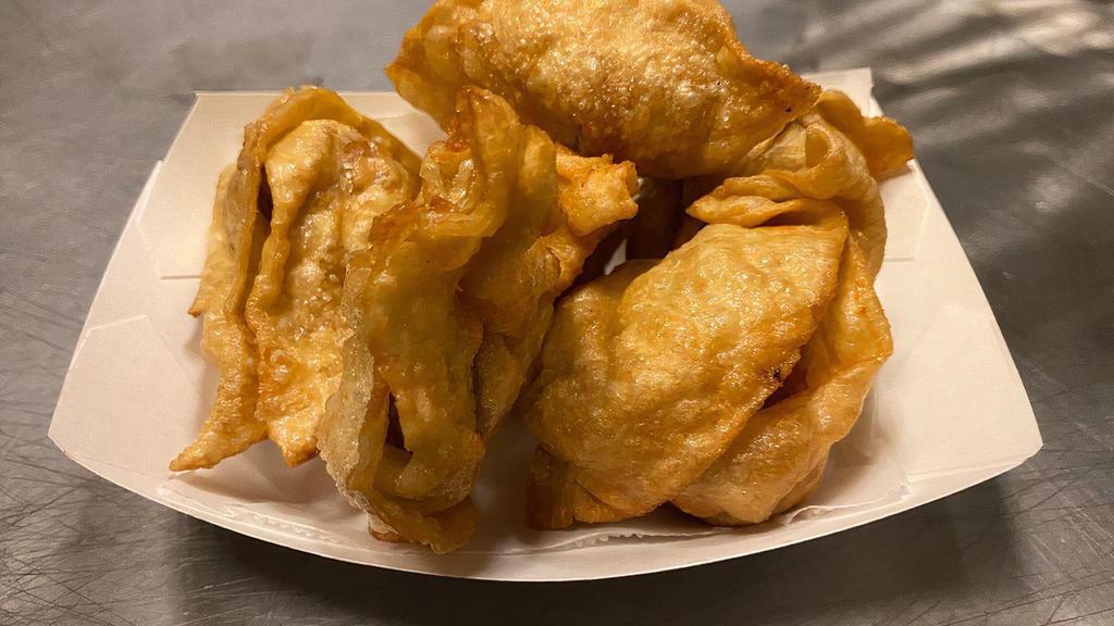 Fried Meat Wontons (6) · House made pork wontons deep-fried served with choice of dipping sauce. (mild ginger dipping sauce, sweet & sour, garlic sauce)