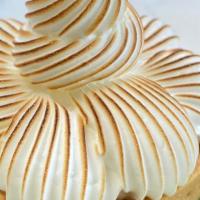 Lemon Meringue Tart · A delicate vanilla tart shell filled with a tart lemon cream, topped with Swiss meringue.