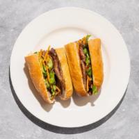 Meat Lover Banh Mi · Char-grilled lemongrass marinated pork. Prepared with cilantro, cucumber, jalapeno, and pick...