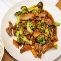 Beef And Broccoli · Sliced beef with broccoli, carrots in brown sauce.