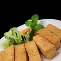 Salt N’ Peper Toasted Tofu · Golden fried tofu tossed in lemon salt peper seasoning. Served with house sweet & sour sauce...