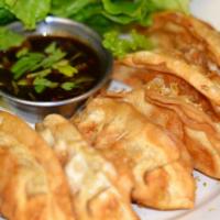 Thai Gyoza (6Pcs) · Deep-fried rice paper stuffed w/ minced chicken & veggies mixed in special spices. Served w/...