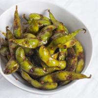 Roasted Chili Edamame · Spicy. Edamame wok-tossed in Mam’s homemade roasted chili & mixed soy sauce reduction.