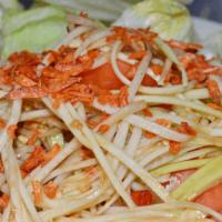 Som Tum (Papaya Salad) · Spicy. Shredded green papaya mixed in lime juice, Thai chili, palm sugar, fish sauce, tomato...