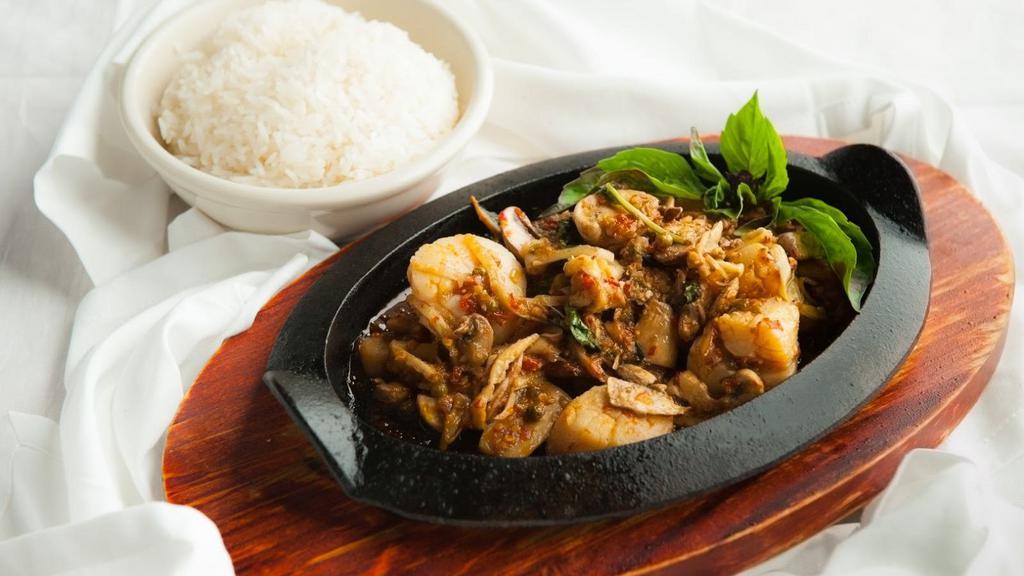 Pad Cha · Spicy. Stir-fried choice of meat w/ young tender bamboo shoot, mushroom & Thai basil in a very hot & spicy sauce, young peppercorn, Thai chili & garlic. Served on a sizzling plate.