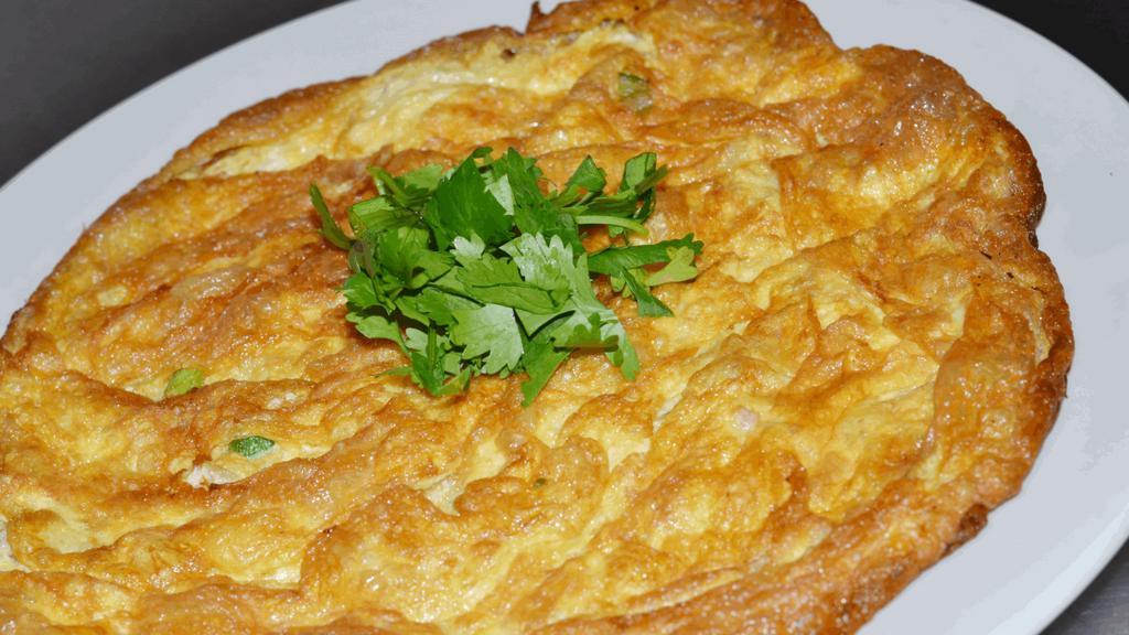 Kai Jeaw · Wok-fried, Thai omelet (3 eggs) w/ your choice of protein, chopped green onion & mixed soy sauce.