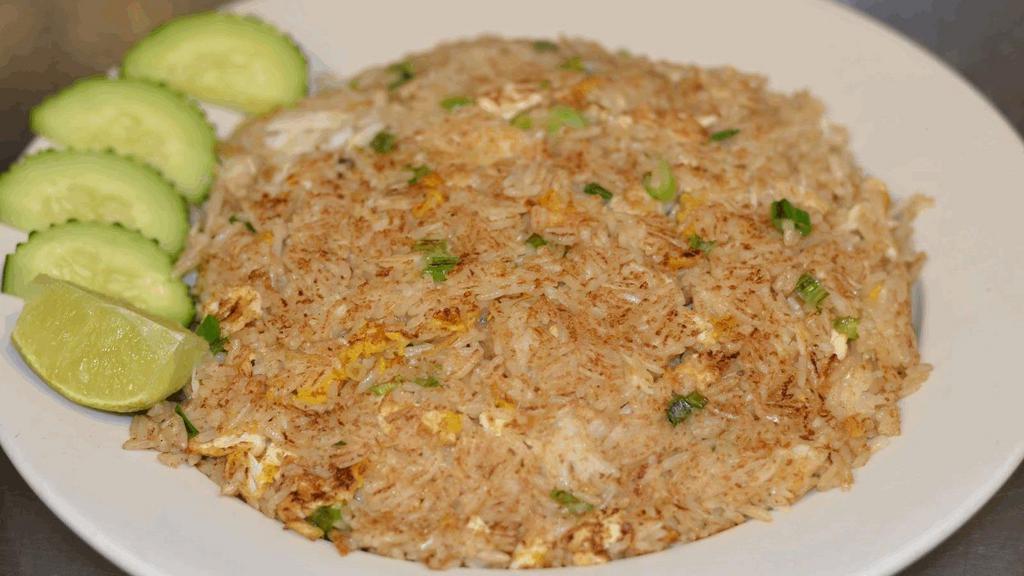 Crab Fried Rice · Stir-fried rice w/ fresh lump crab meat, egg, green onion w/ mixed soy sauce, wok-fried until light brown perfection.