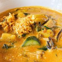 Kaeng Daeng Vegetables · Spicy. Red curry w/ zucchini, yellow squash, three kinds of mushrooms & Thai basil.