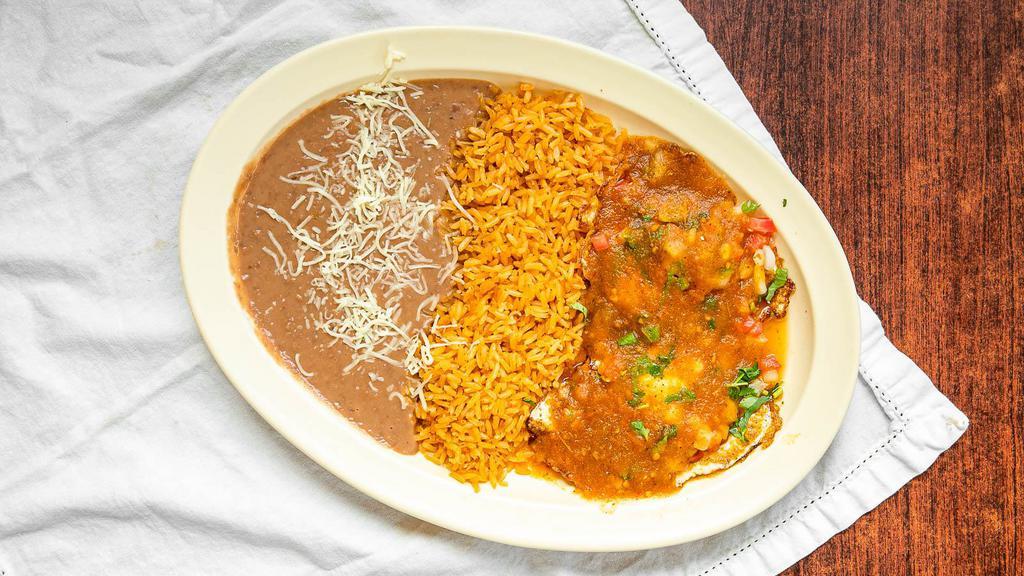 Huevos Rancheros · Eggs with ranchero sauce. Served with rice and beans