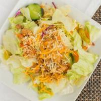 Grilled Chicken Salad · Chicken, lettuce, tomatoes, carrots, green bell peppers, red cabbage, pepperoncini, cheese.