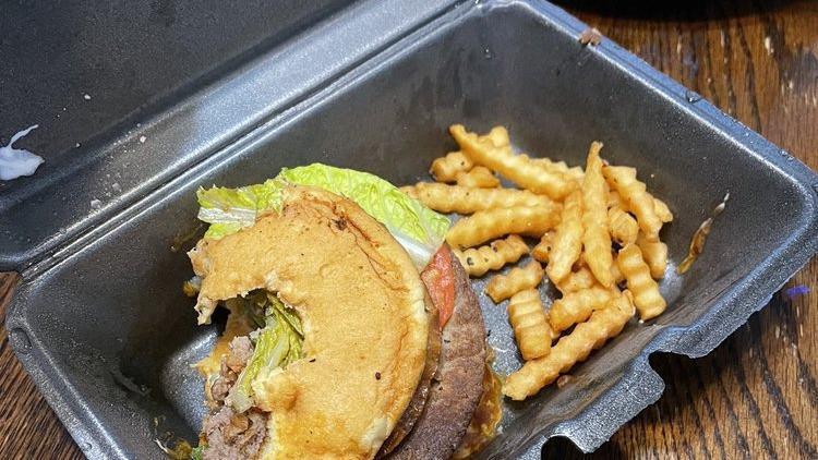 Impossible™ Burger · Lettuce, tomato, pickle on a butter brioche bun.