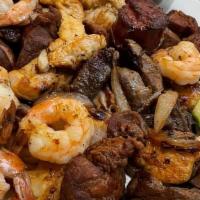 Parrillada · Chicken, beef, and shrimp. Grilled chiles with tortillas.