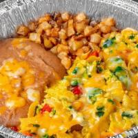 Migas Plate · A huge helping of eggs, tortilla strips, onions, tomatoes, serrano peppers and cheese, all s...