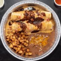 Early Bird Enchiladas · Two flour tortillas filled with scrambled eggs, bacon, spicy pork, fresh jalapenos, mixed ch...