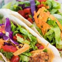 Grilled Fish Taco Combo · Two flour tortillas filled with grilled cod and our salad mix. Served with a side of Habaner...