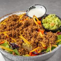 Taco Salad · Your choice of meat with salad mix, tortilla strips and tomatoes, topped with Monterey jack ...