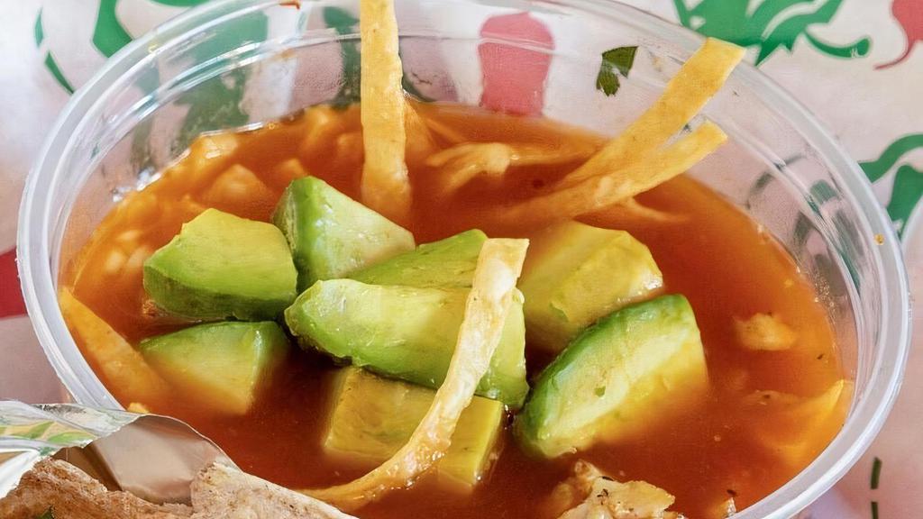 Taco Joe'S Tortilla Soup · A delicious bowl of hearty veggies and chicken in broth with tortilla strips, cheese, and avocado.